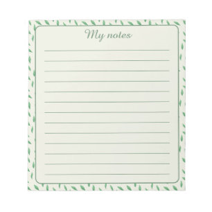 with green leaf design notepad