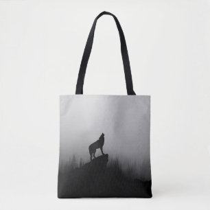 Wolf howling at the moon tote bag