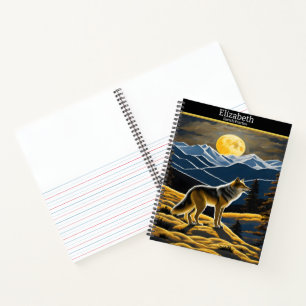 Wolf howls at the luminous moon on a sketchbook notebook