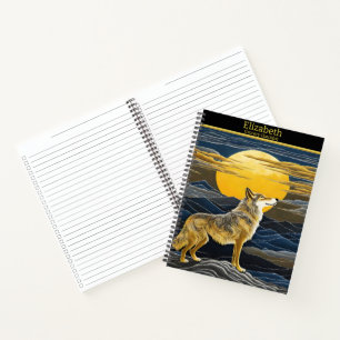 Wolf howls under a glowing moon notebook