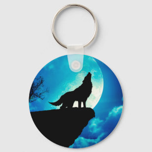 Wolf in silhouette howling to the full moon keychain