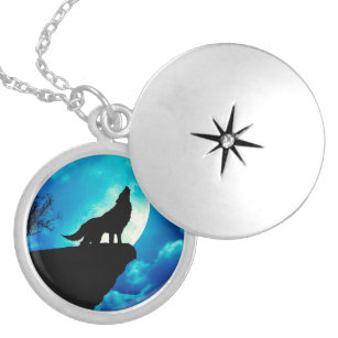 Wolf in silhouette howling to the full moon locket necklace