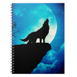Wolf in silhouette howling to the full moon notebook