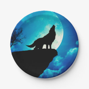 Wolf in silhouette howling to the full moon paper plate