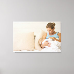 Woman breastfeeding baby canvas print