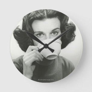 Woman Drinking Round Clock