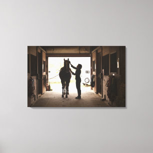 Woman grooming horse canvas print