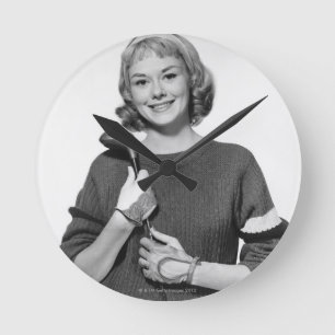 Woman Holding Golf Club Round Clock