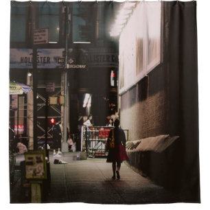 WOMAN IN BLACK AND RED DRESS WALKING BESIDE BROWN