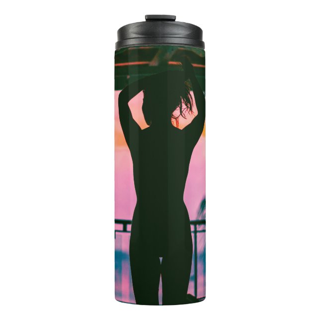 Woman in black tank top and pants standing on blac thermal tumbler (Front)