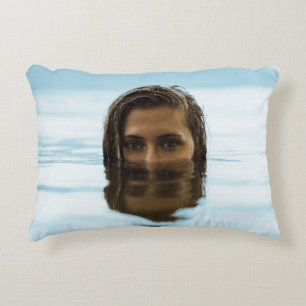Woman in body of water in the morning accent pillow