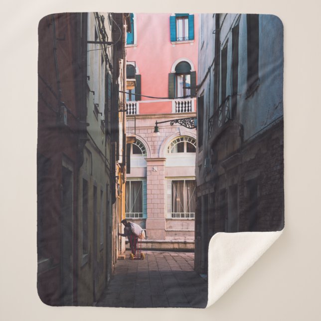 WOMAN IN WHITE SHIRT AND BLACK PANTS WALKING ON SI SHERPA BLANKET (Front)