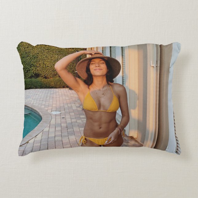 Woman in yellow bikini standing on brown brick flo accent pillow (Front)