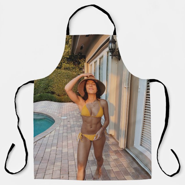 Woman in yellow bikini standing on brown brick flo apron (Front)