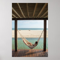 Woman Laying On A Hammock At A Small Hotel
