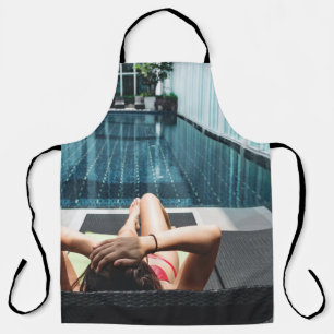 Woman laying on brown chaise lounge apron