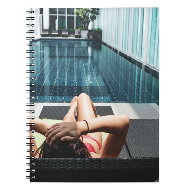 Woman laying on brown chaise lounge notebook (Front)