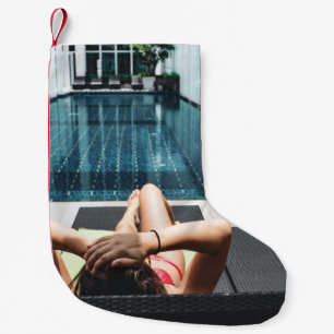 Woman laying on brown chaise lounge small christmas stocking