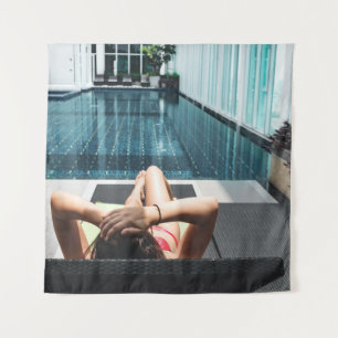 Woman laying on brown chaise lounge tapestry