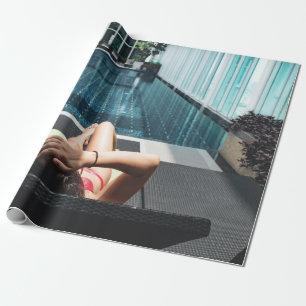 Woman laying on brown chaise lounge wrapping paper