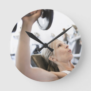 Woman Lifting Weights Round Clock