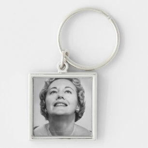 Woman Looking Up Keychain