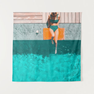 Woman lying beside swimming pool in the morning tapestry