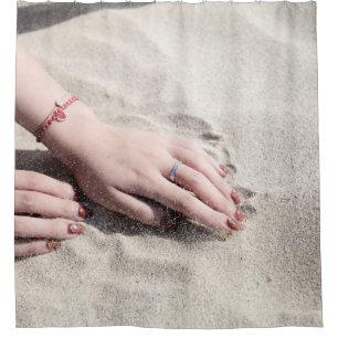 Woman lying on white sand