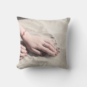 Woman lying on white sand throw pillow
