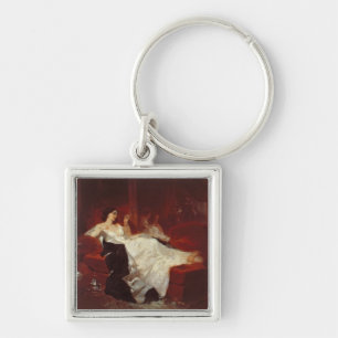 Woman on a red sofa keychain