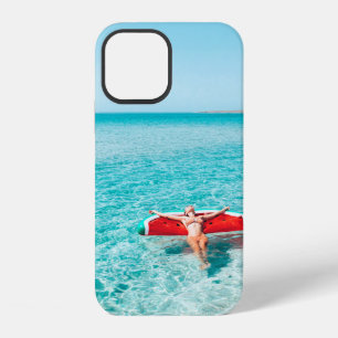 Woman on lilo in the sea water. Girl relaxing on i iPhone 12 Case
