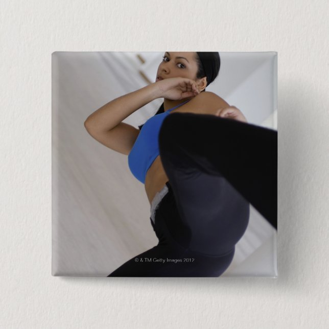 Woman performing martial arts 2 inch square button (Front)