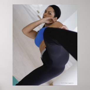 Woman performing martial arts poster