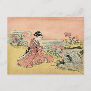 Woman picking chrysanthemums postcard