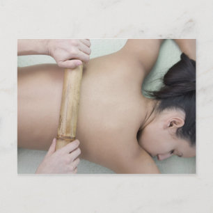 Woman receiving spa treatment postcard