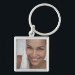Woman scrubbing her face with cloth keychain<br><div class="desc">AssetID: 127825260 / {GretaMarie} / Woman scrubbing her face with cloth</div>