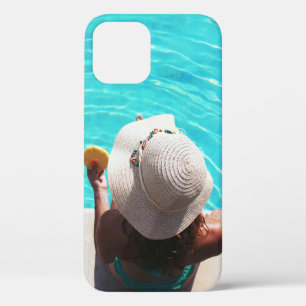 Woman sitting beside swimming pool iPhone 12 case