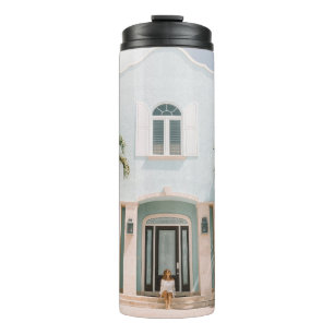 Woman sitting in front of building thermal tumbler