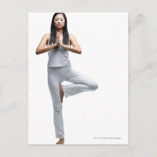 Woman standing in yoga position postcard
