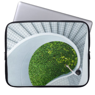 Woman standing spiral stairs laptop sleeve