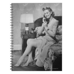 Woman Talking on Phone Notebook