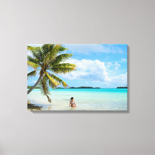 Woman under a palm tree in the Pacific canvas Print
