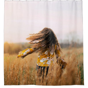 Woman walking on field at daytime