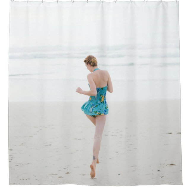 Woman walking on shore near beach (Front)