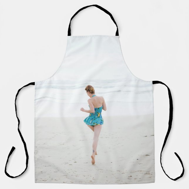 Woman walking on shore near beach apron (Front)