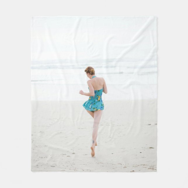 Woman walking on shore near beach fleece blanket (Front)