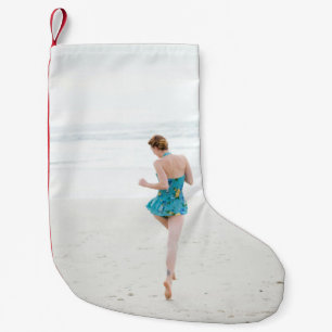 Woman walking on shore near beach small christmas stocking