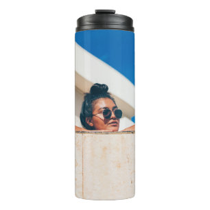 Woman wearing black sunglasses thermal tumbler