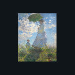 Woman with a Parasol by Claude Monet Canvas Print<br><div class="desc">Woman with a Parasol - Madame Monet and Her Son by Claude Monet, oil on canvas 1875, is a painting of a woman in a white dress holding an umbrella over her head upon the top of a hill covered in grass and wildflowers, backlit against a brilliant blue sky and...</div>