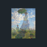 Woman with a Parasol by Claude Monet Canvas Print<br><div class="desc">Woman with a Parasol - Madame Monet and Her Son by Claude Monet, oil on canvas 1875, is a painting of a woman in a white dress holding an umbrella over her head upon the top of a hill covered in grass and wildflowers, backlit against a brilliant blue sky and...</div>
